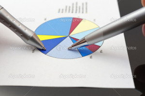 business people analyzing market report on pie chart